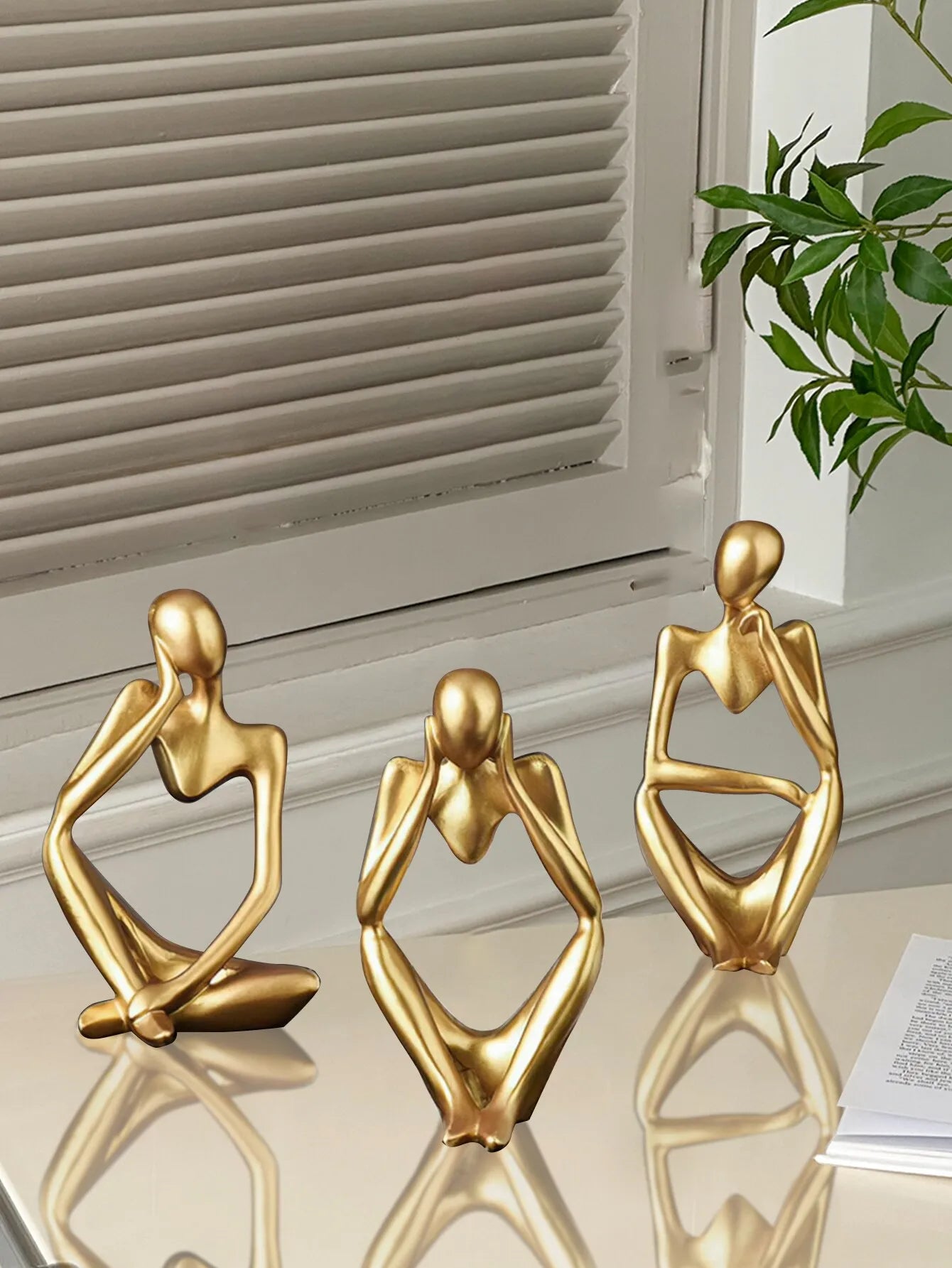 Ornamental thinking man in gold